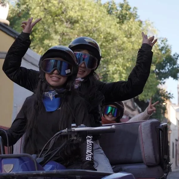 Guey Tours Combine ATV Tours with a Fun City Tour Adventure Two women in goggles enjoying a Guey Tours City Tour on an ATV, blending thrills with an ATV Tours experience.